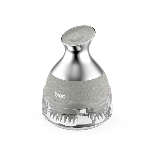 Silver handheld scalp massager with flexible silicone bristles for hair growth and relaxation - Odelia N Olivia
